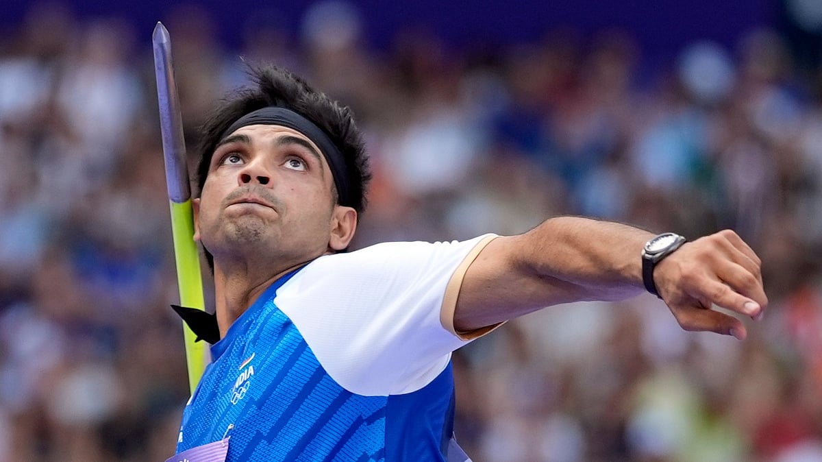 (AP Photo/Matthias Schrader) : Neeraj Chopra, of India, competes during the men's javelin throw qualification at the 2024 Summer Olympics, Tuesday, Aug. 6, 2024, in Saint-Denis, France.